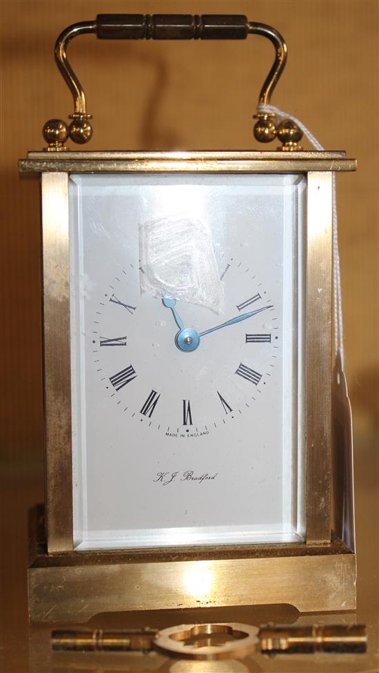 Modern brass carriage timepiece, dial inscribed KJ Bradford